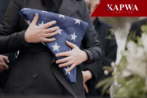 Person holding folded American flag