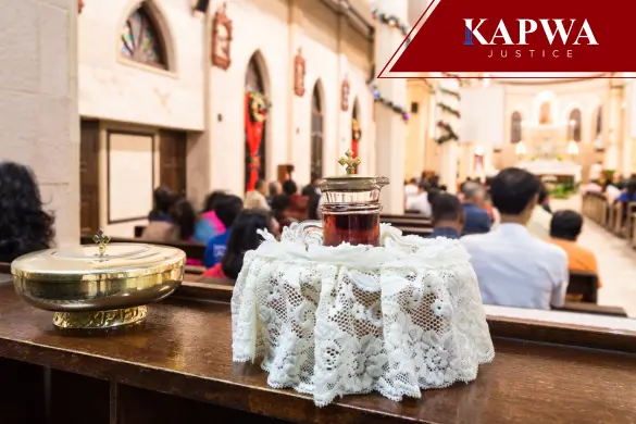 Chalice with wine and ciborium on a table in a Catholic church